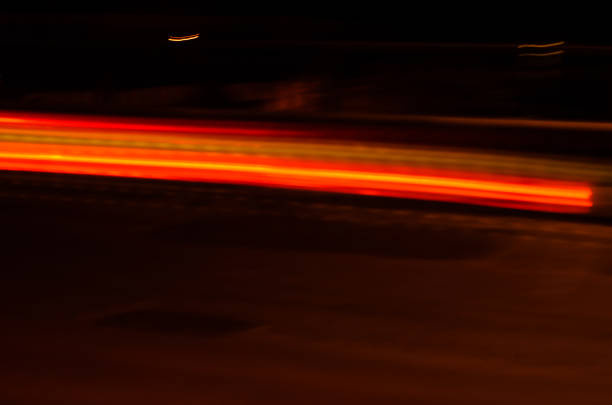 Trails of the car lights on night road
