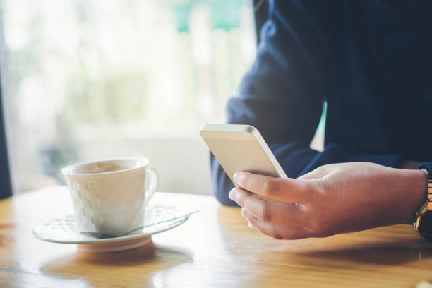 istock woman using on mobile phone during rest in coffee shop 667060062