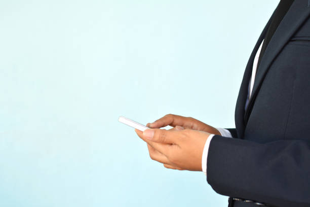 istock Businesswomen using smartphone on blue background selective and soft focus 667063320