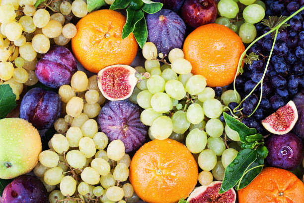 istock Fruit Background with Grape, Orange, Figs on Blackboard Background. Healthy Food 667063906