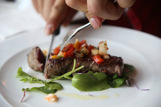 istock Eating steak with salad in a restaurant 667082554