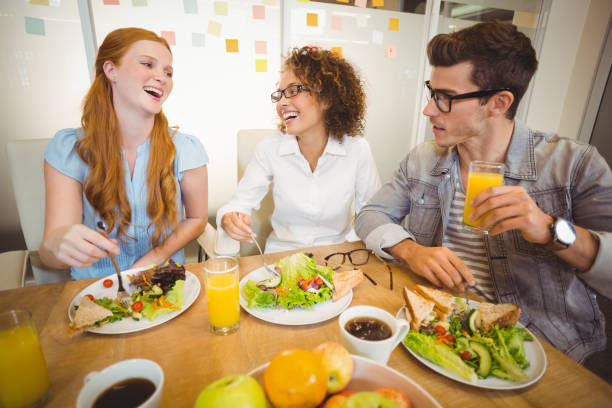 istock Happy business people having lunch 667092452