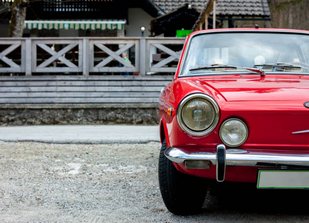 istock red retro car in the countryside 667093656