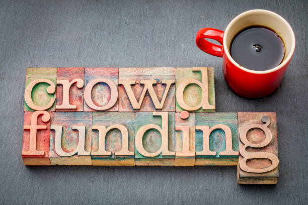 crowdfunding word in wood type crowdfunding word abstract in letterpress wood type with a cup of coffee printing block photos stock pictures, royalty-free photos & images