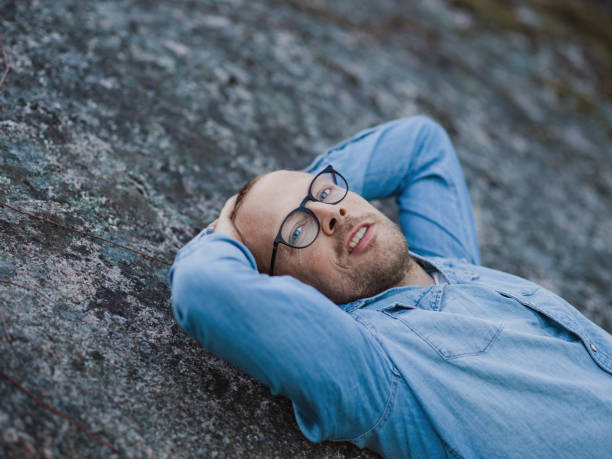 istock Handsome real man outdoors in nature in spring 667097512