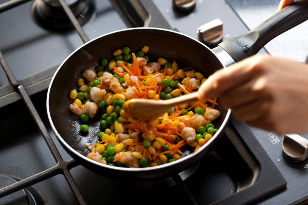 Cooking concept,  mix vegetable in the pan on cooking stove in kitchen