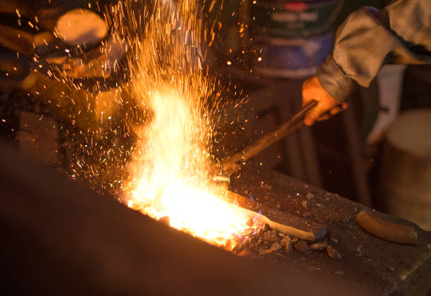 istock Making of horseshoe. Hot horseshoe in forge. 667099414