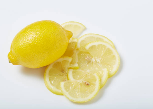 lemons - vibrant color part of full studio shot stock-fotos und bilder