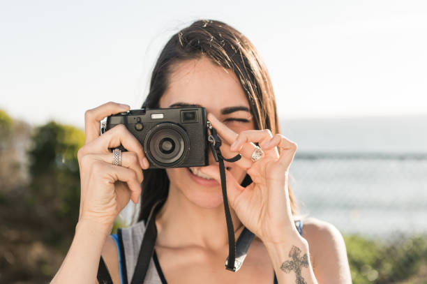 istock Beautiful Hispanic Women Taking A Photo 667102970