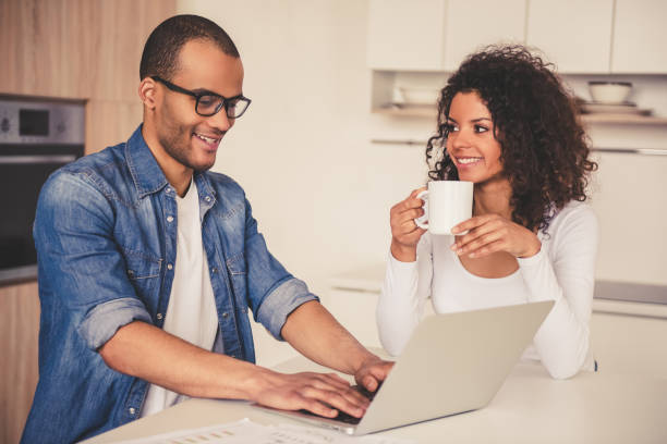 istock Afro American couple in kitchen 667103496