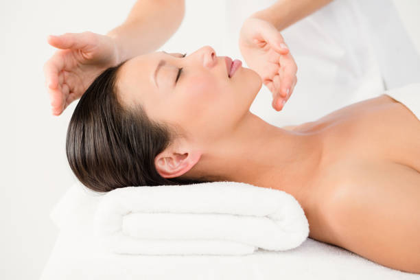 Young woman receiving alternative therapy at health spa