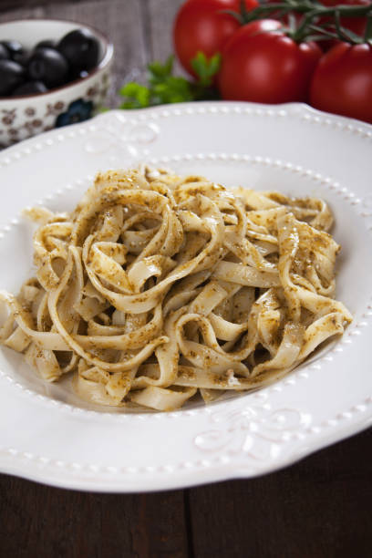 istock Italian pasta with pesto genovese 667104122