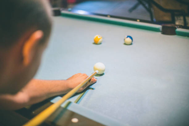 istock Playing billiard - Close-up shot of a man playing billiard 667104164