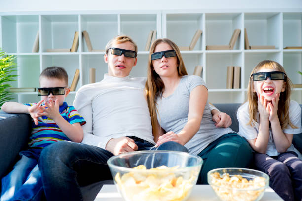 istock Family watching a 3d movie 667108026
