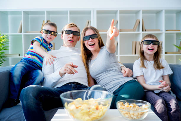 istock Family watching a 3d movie 667108108