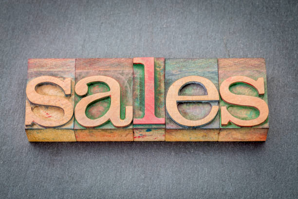 istock sales word abstract in wood type 667110208