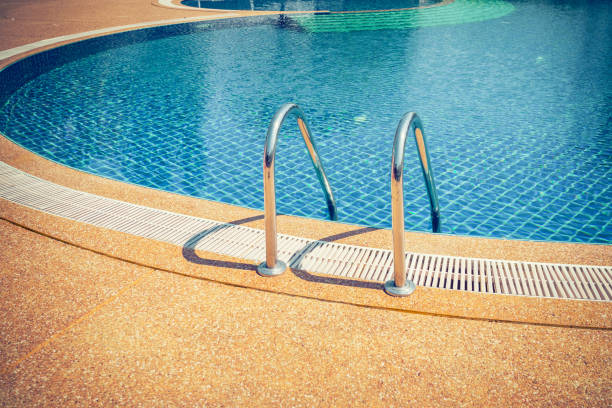 istock swimming pool with stair at sport center 667110836