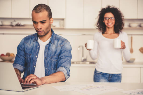istock Afro American couple in kitchen 667111138