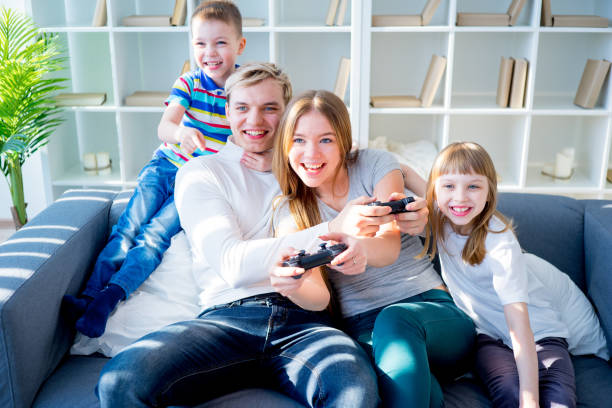 istock Family playing video games 667124130