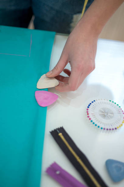 istock Seamstress woman preparing material 667124776