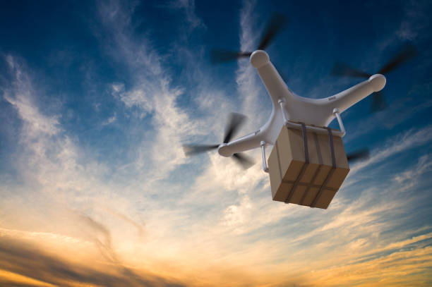 istock 3D rendered illustration of drone flying in the sky and delivering a package at sunset. 667124968
