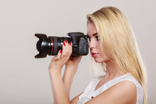 istock Beautiful woman with camera. 667125100