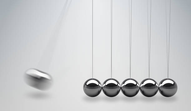 istock 3D rendered illustration of Newtons cradle - balancing balls. 667127240