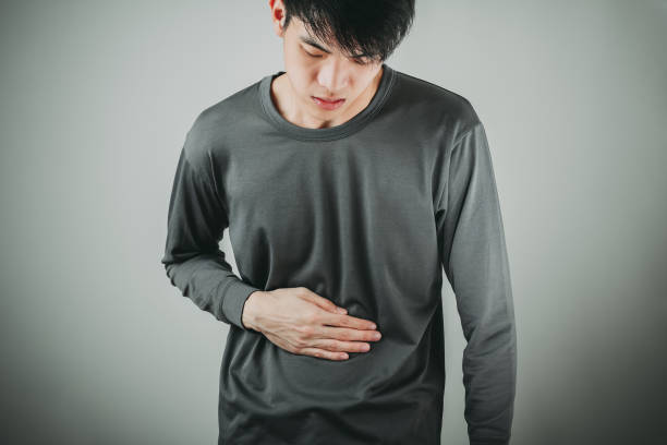 man stomachache young man having a stomachache intestinal tract infection stock pictures, royalty-free photos & images