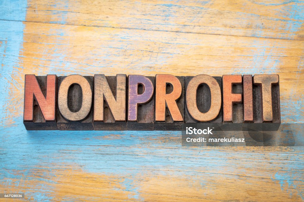 nonprofit word  in wood type nonprofit banner - word abstract in vintage letterpress printing blocks stained by color inks Non-Profit Organization Stock Photo