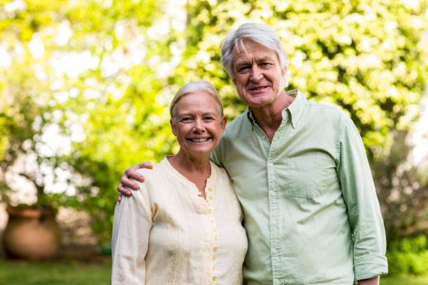 istock Smiling senior couple in yard 667131180