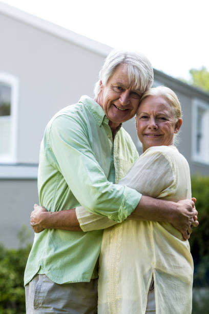 istock Smiling senior couple embracing 667132120