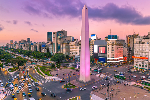 Plaza de la Republica in the centre of Buenos Aires with the Obelisco, one of the main symbols of the capital of Argentina at dawn with heavy traffic
