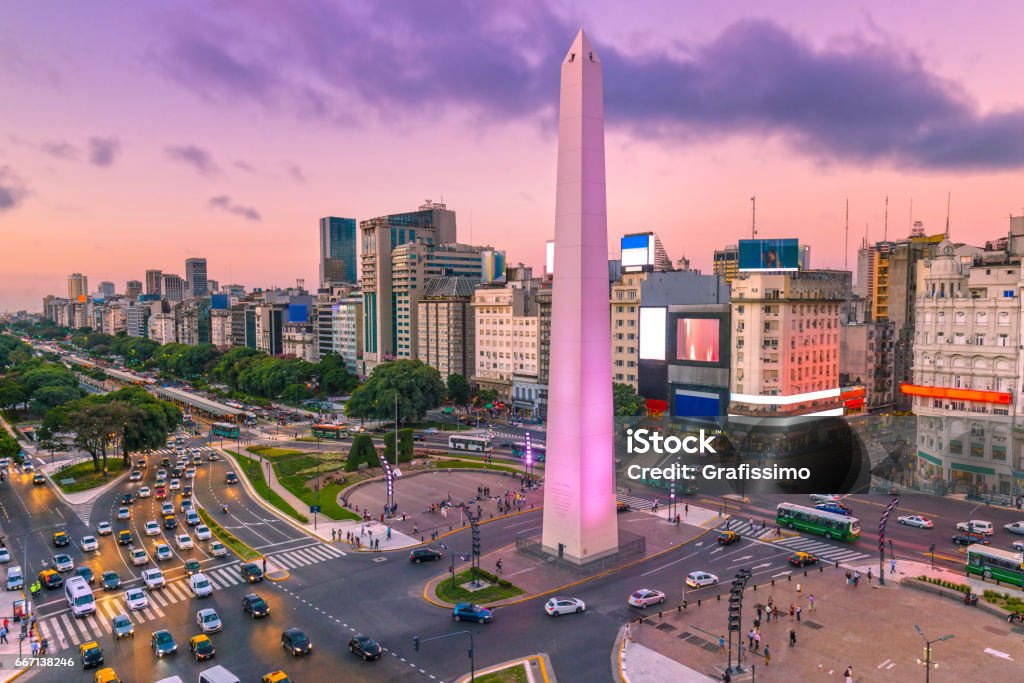 Argentina Buenos Aires dawn at center with rush hour Plaza de la Republica in the centre of Buenos Aires with the Obelisco, one of the main symbols of the capital of Argentina at dawn with heavy traffic Buenos Aires Stock Photo