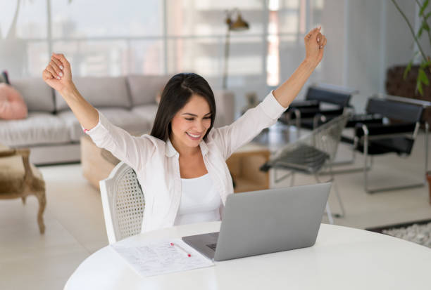 istock Successful woman working online at home 667138684