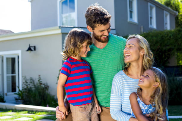istock Parents with children against house 667139490