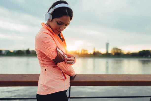 istock Woman running on riverside 667144666