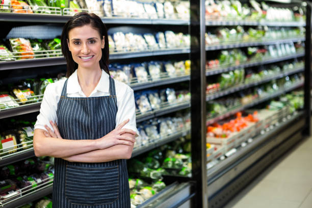 istock Pretty brunette looking at camera with arms crossed 667148092