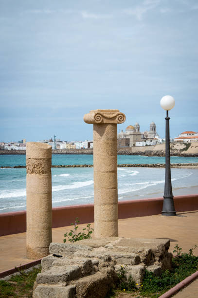 istock Historic columns at the beach in Cadiz, Spain 667165738