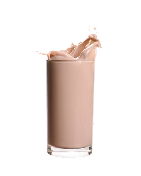 Chocolate Milk Splashing Splash of chocolate milk from the glass on isolated white  background. chocolate shake stock pictures, royalty-free photos & images