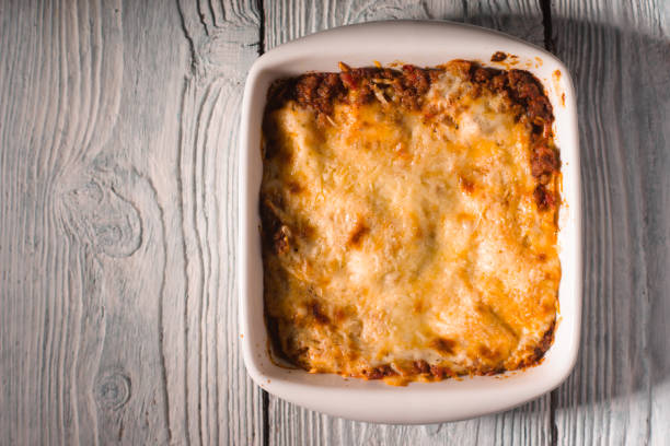 istock Homemade Meat lasagna on wooden table copy space 667176698