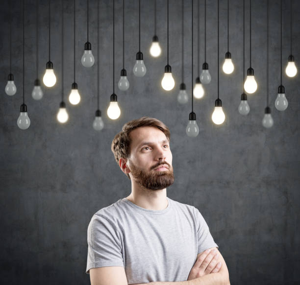 istock Bearded man and bulbs on wires 667179770