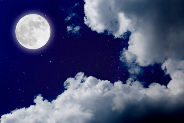 istock Romantic night with full moon over stars with cloudscape . 667184628