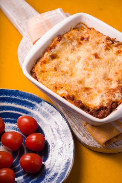 istock Homemade Meat lasagna and tomato on stand side view 667187144