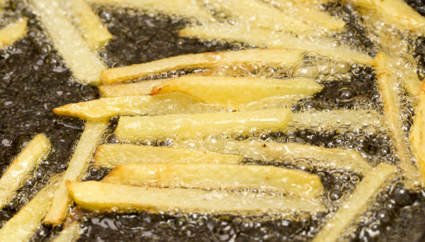 istock French fries fried in a pan 667187538