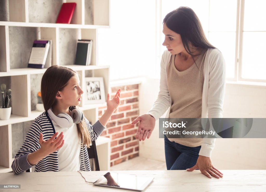 Mom and troubled daughter Troubled teenage girl and her mom are quarreling at home Parent Stock Photo