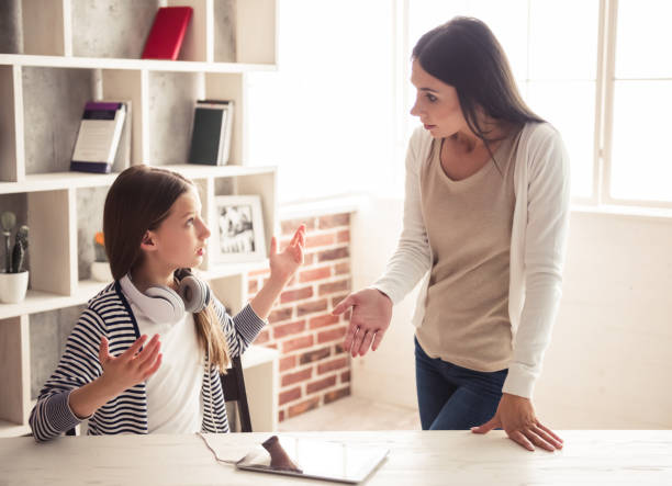 Mom and troubled daughter stock photo