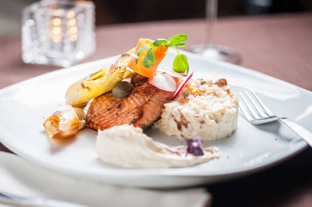 istock Cooked salmon with rice and vegetables 667195874