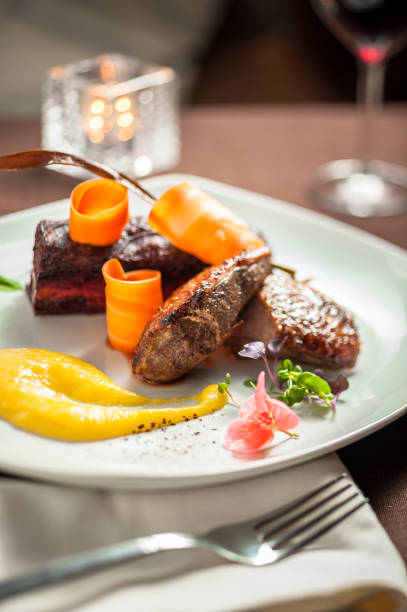 istock Grilled steak with vegetables and sauce 667199442