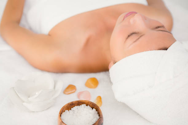 istock Relaxed woman lying on the massage table 667203098