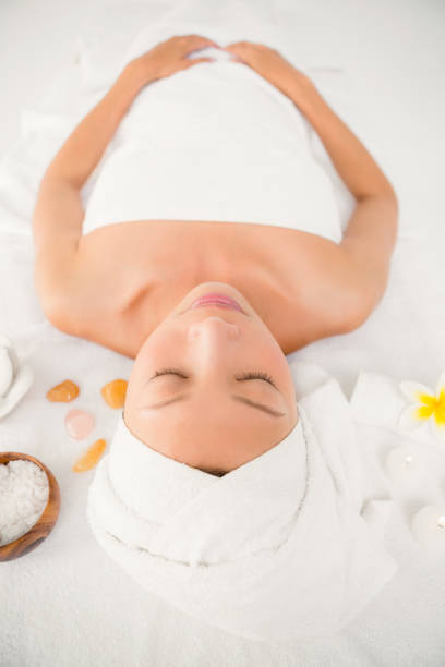 istock Relaxed woman lying on the massage table 667203226